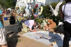 Signing banner in front of Emanuel on Friday after the tragedy; such testimonials prompted call to Liz Alston