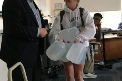 Student-w-64-lbs-of-water-being-told-to-now-walk-several-miles-in-100-degree-weather-or-rain